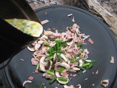 Step_4_add_egg_mixture_of_beaten_egg__parsley_seasoning__and_a_dash_of_cream.jpg