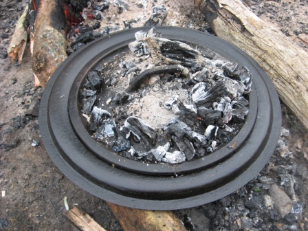 Step_7_Cover_15inch_Bullmans_lid_with_preheated_12inch_lid_with_coals.jpg